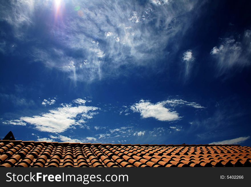 Bright and clean image of a roof and a cloudy sky. Bright and clean image of a roof and a cloudy sky