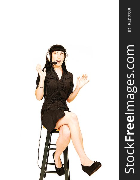 An fit woman in a black dress sitting in an call centre 
for white background and talking to her customer. An fit woman in a black dress sitting in an call centre 
for white background and talking to her customer.