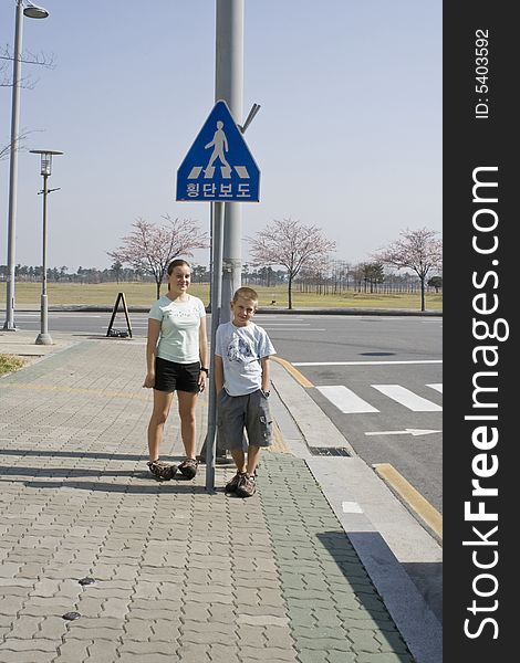 European children at a pedestrian crossing in Korea. European children at a pedestrian crossing in Korea.