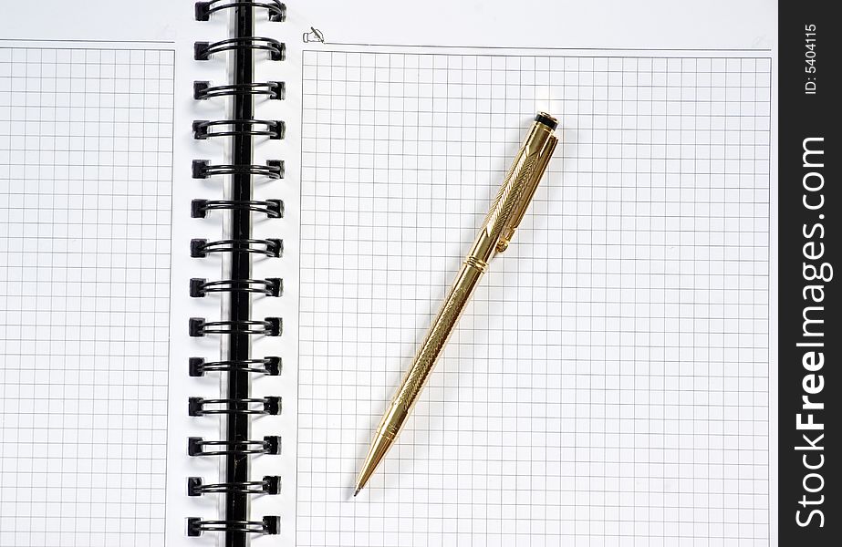 Notebook with the handle lays on a white
