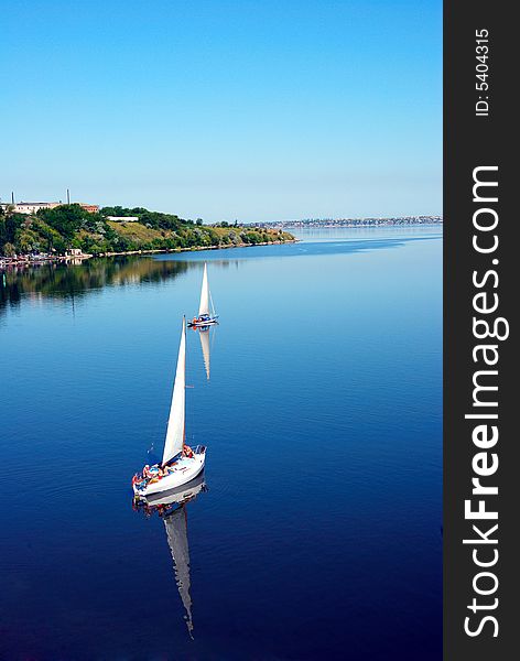 Calm river scenic with yachts. bird fly view