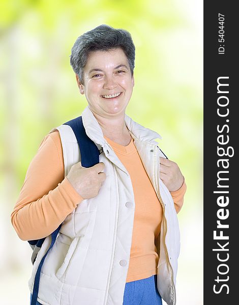 Senior woman on walk in countryside