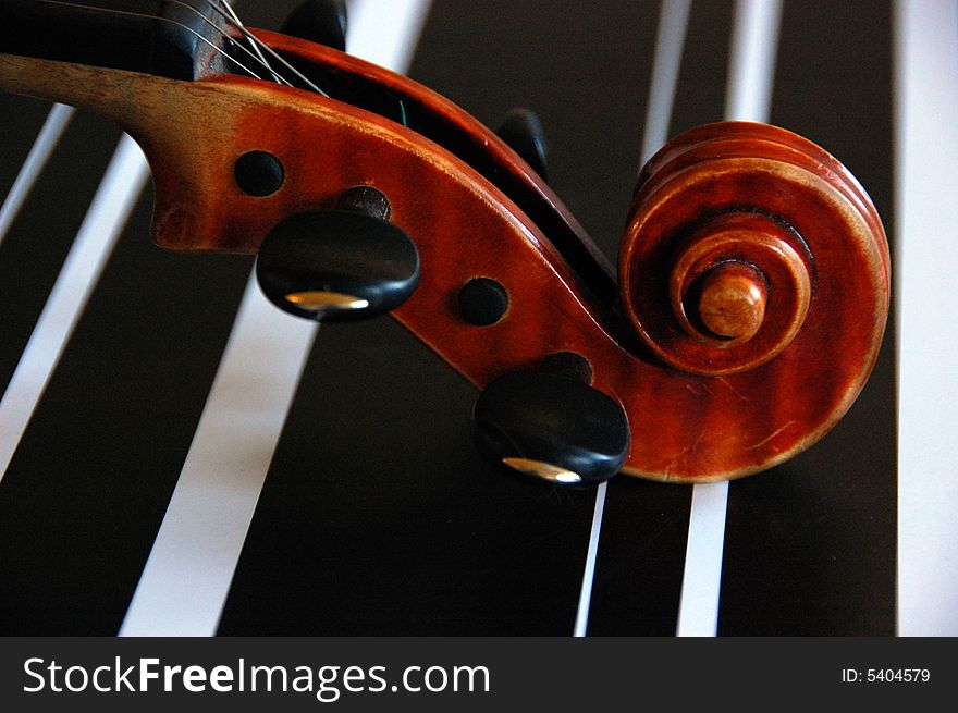 Violin scroll on black end wait background