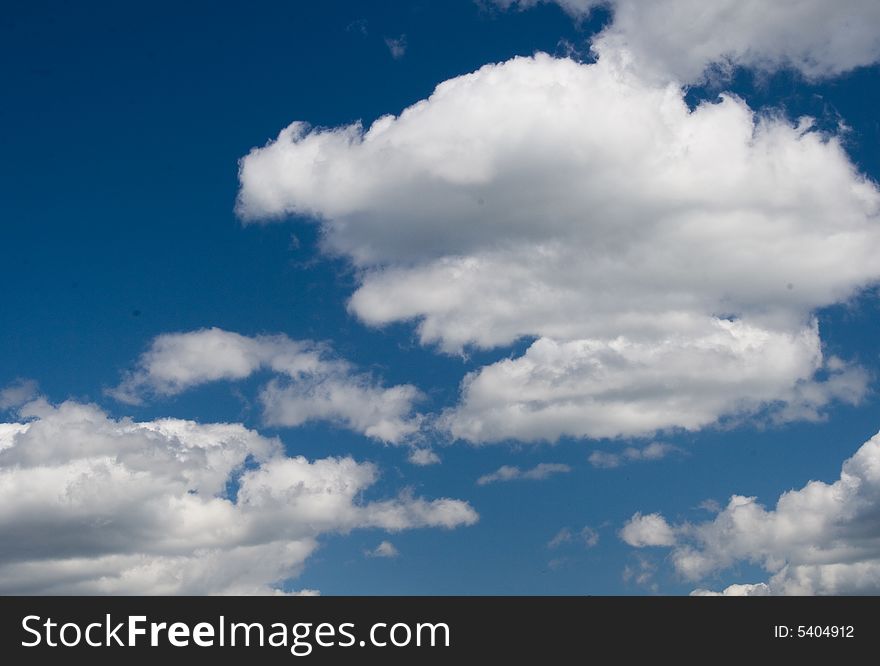 Easy white clouds on blue sky