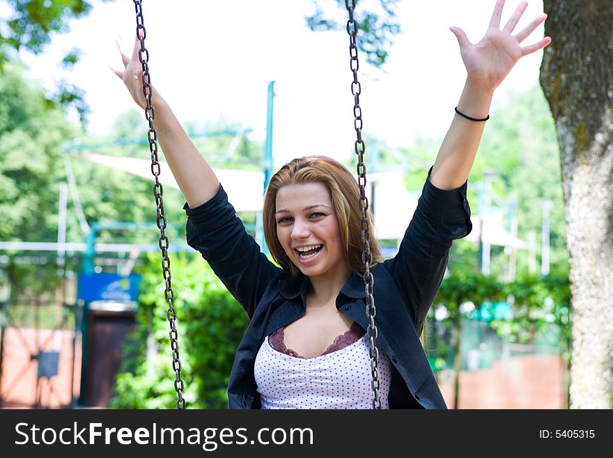 Portrait Of The Young Girl On A Swing