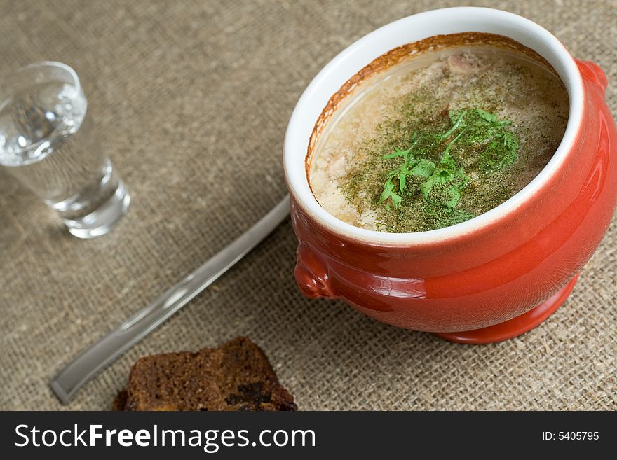 Soup served in a ceramics pot, shallow DOF. Soup served in a ceramics pot, shallow DOF