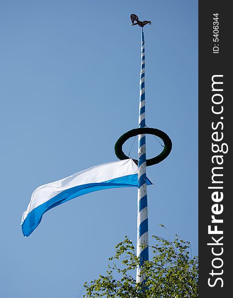 Maypole with bavarian flag in germany