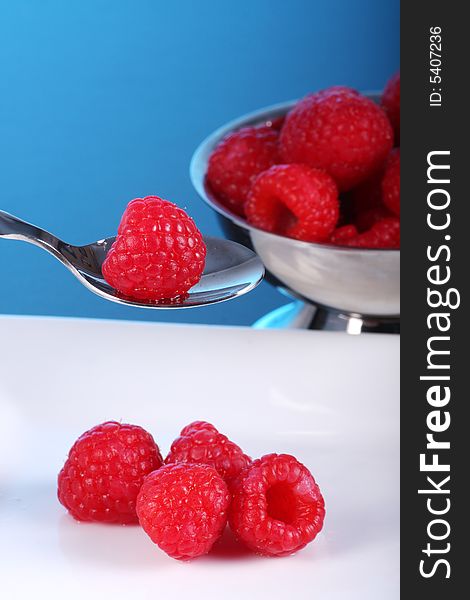 Plate and bowl of fresh raspberry. Plate and bowl of fresh raspberry