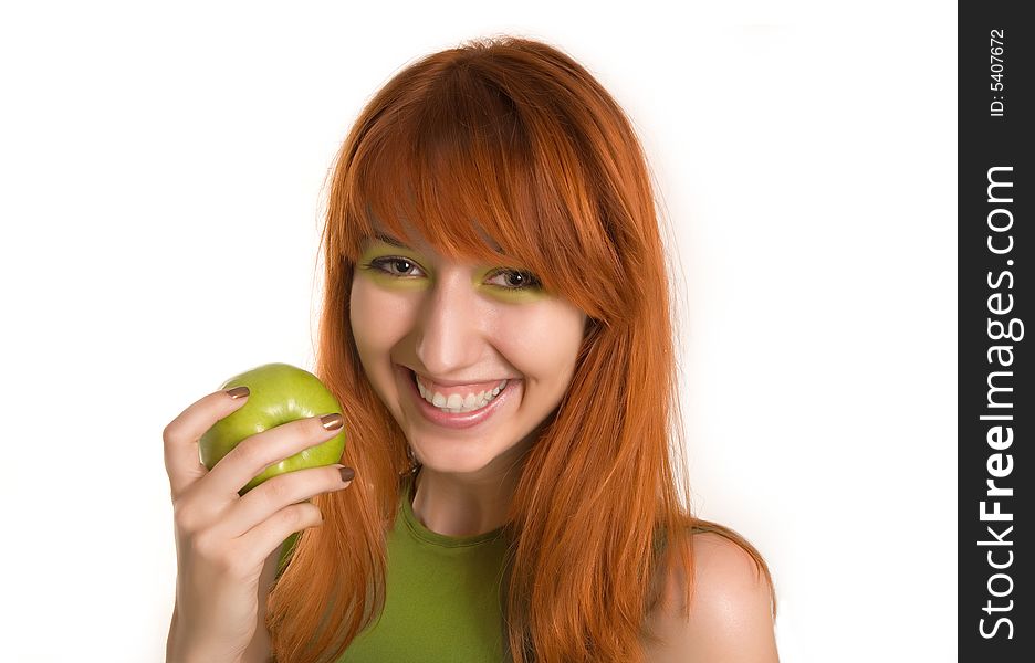 Smiling red-haired girl with green apple