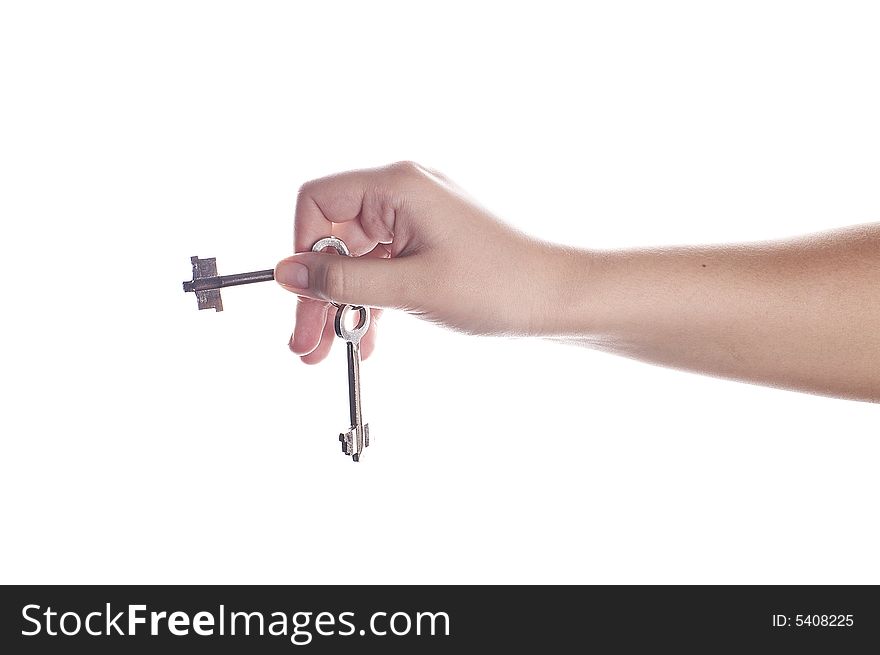 Old keys in hand isolated on white.