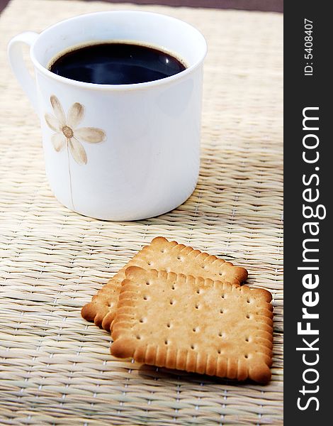 Cup of hot coffee with two biscuits. Cup of hot coffee with two biscuits