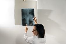 Doctor Points And Laughs At An X-ray-Horizontal Royalty Free Stock Images