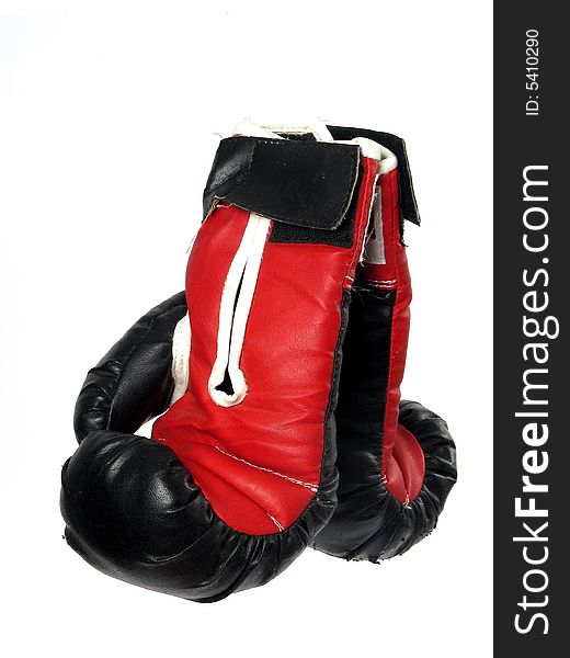 Two boxing gloves that are red and black. Two boxing gloves that are red and black