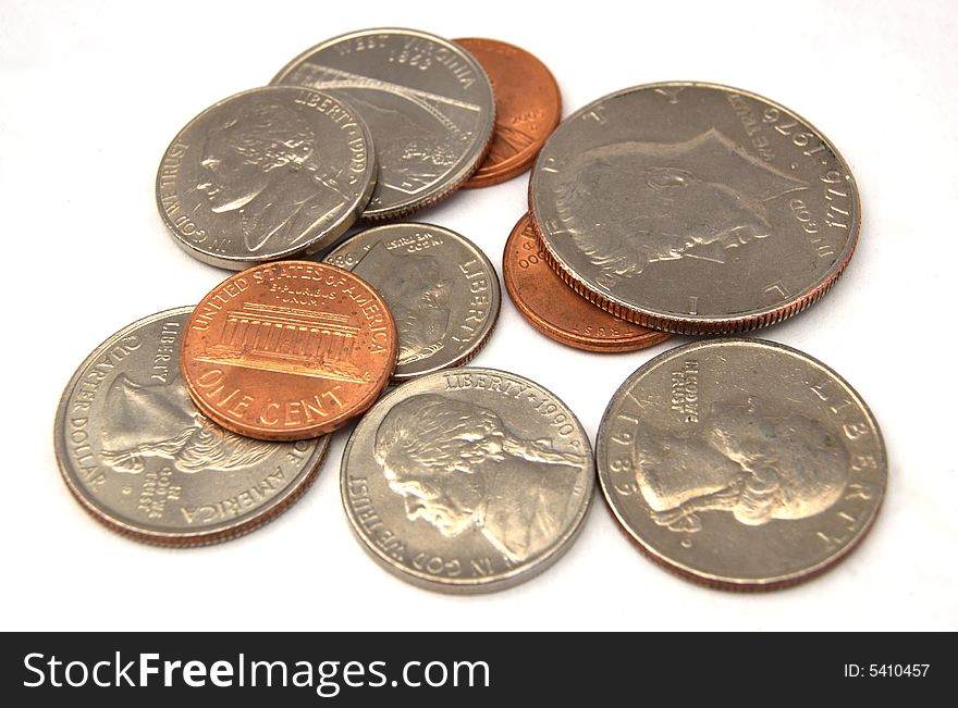 A photograph of a variety of coins against a white background