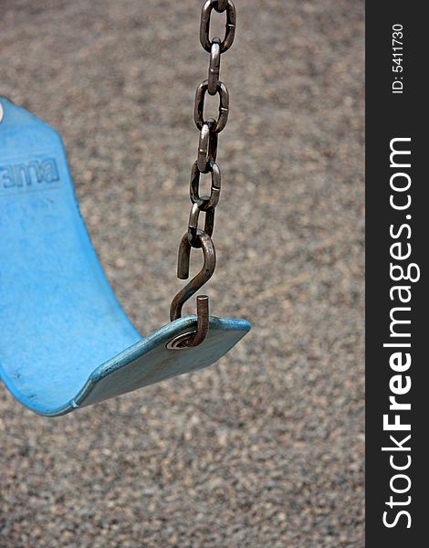 Empty swing at childrens playground area