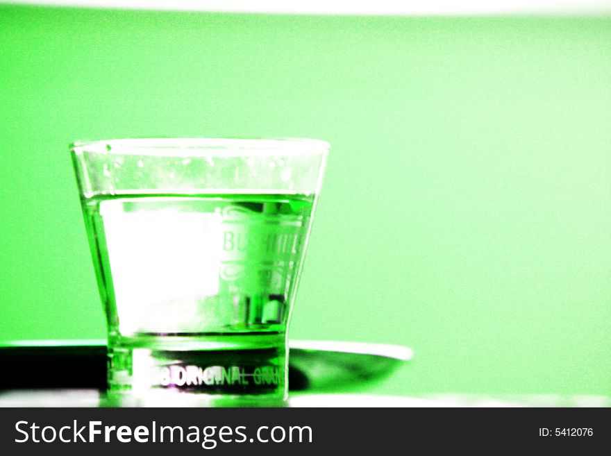 A Glass of water tinted green