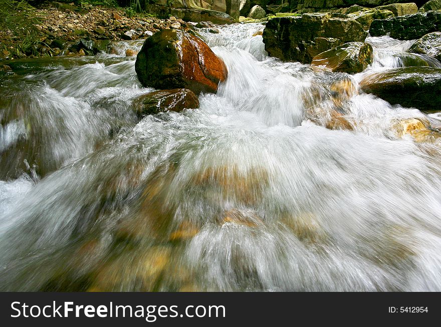 Water flowing quickly in stream. Water flowing quickly in stream