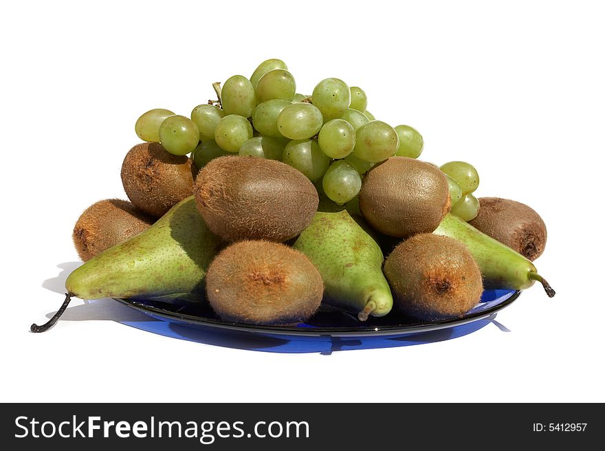 Dark blue plate with fruit on a white background