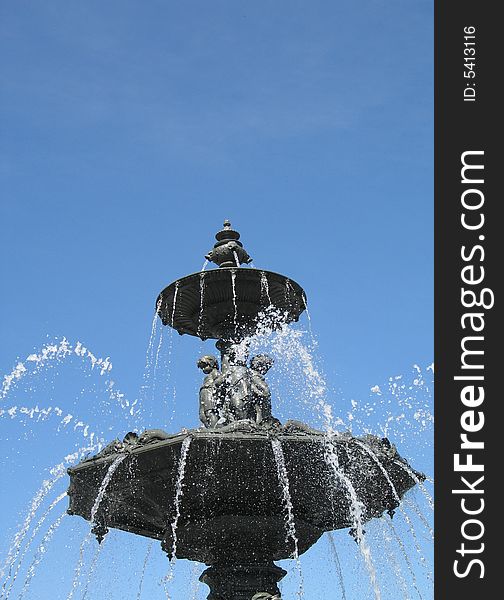 A fountain with blue sky
