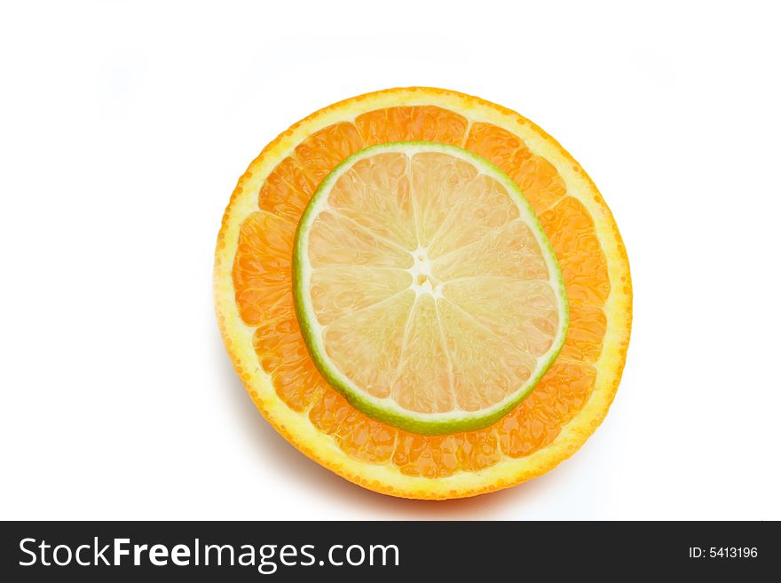 Thin Slice of lime on a slice of orange isolated on white. Thin Slice of lime on a slice of orange isolated on white.