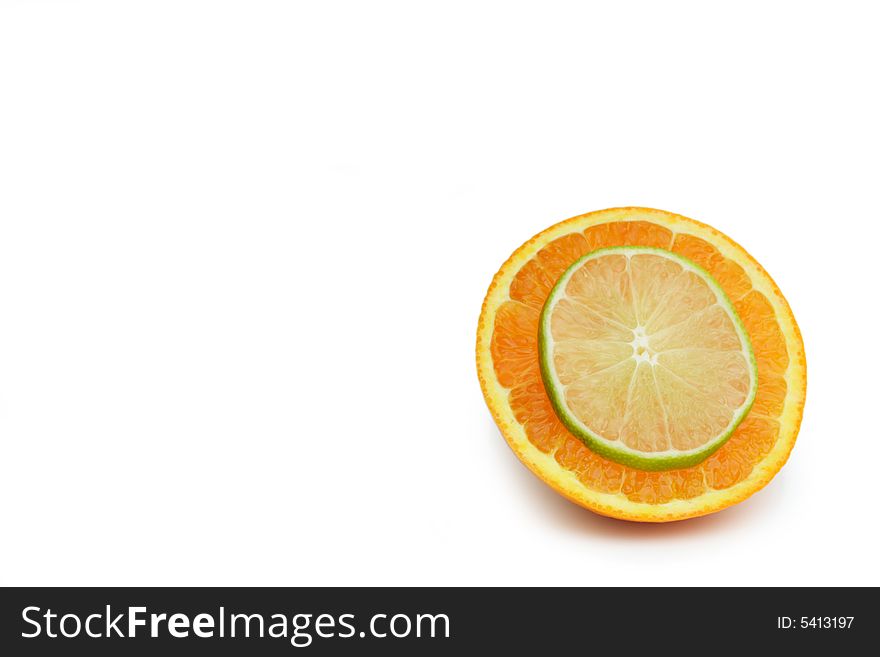 Thin Slice of lime on a slice of orange isolated on white. Thin Slice of lime on a slice of orange isolated on white.