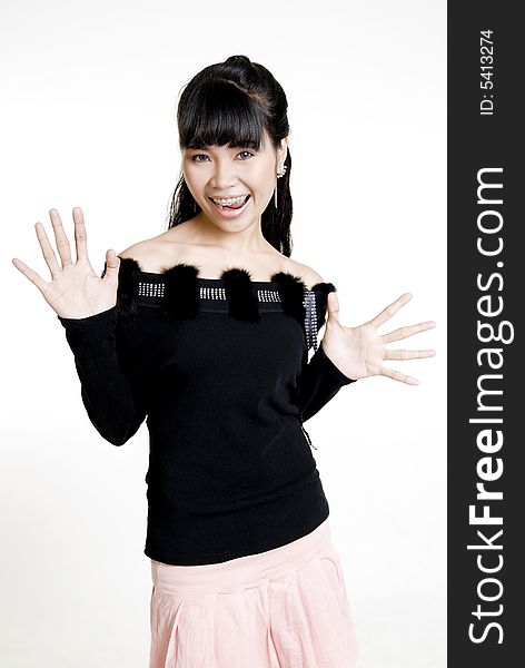 Surprised Asian woman against white background