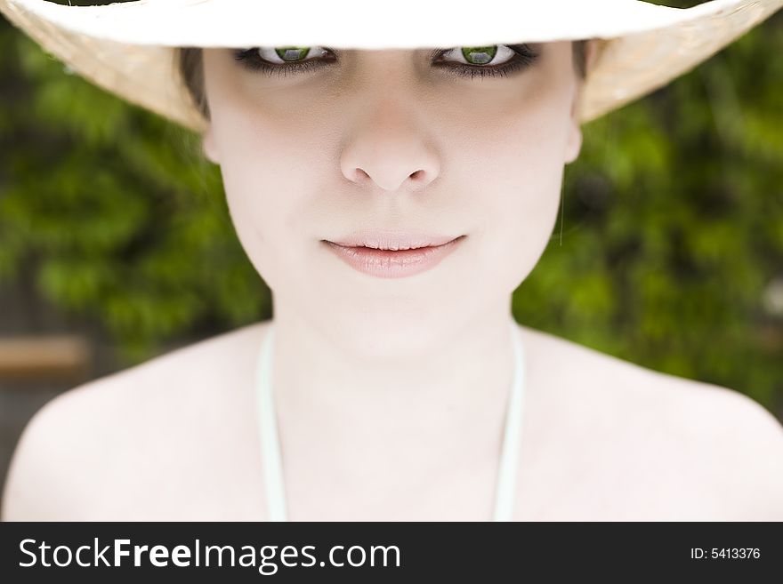 Eyes Under The Hat. Model Woman Relaxing Outdoors.