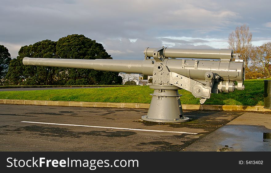 A cannon mounted in a car park