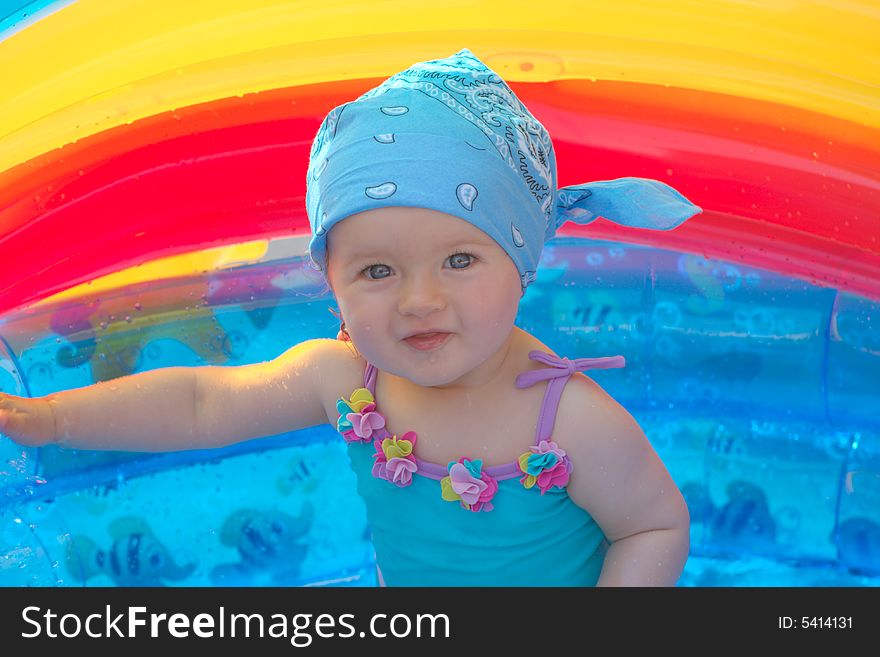 Little Girl In A Small Swimming Pool