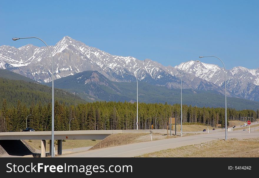 Landscape of spring rocky mountain and highway in kananaskis county, alberta, canada