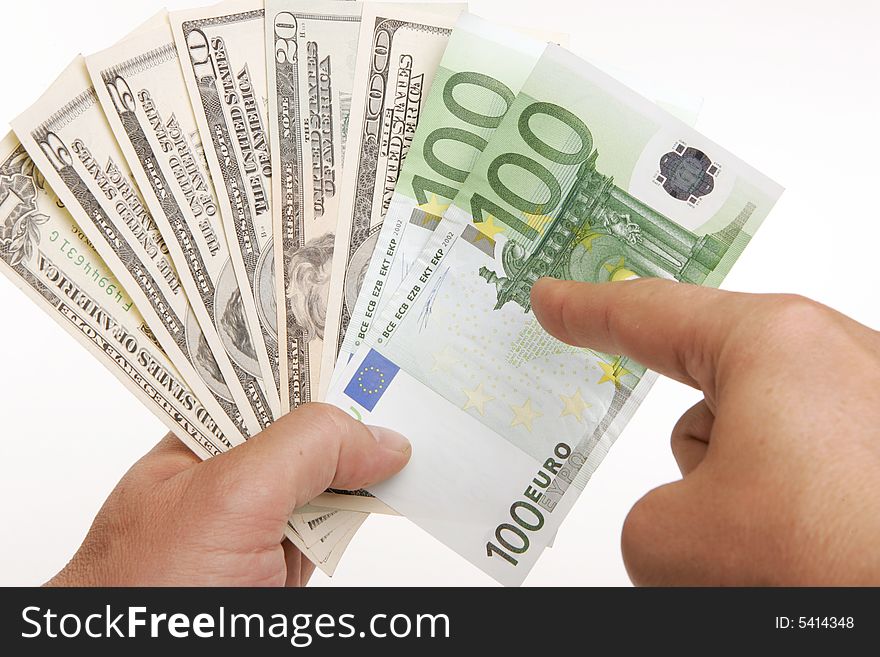 Finger pointing at euros in currency fan. Finger pointing at euros in currency fan