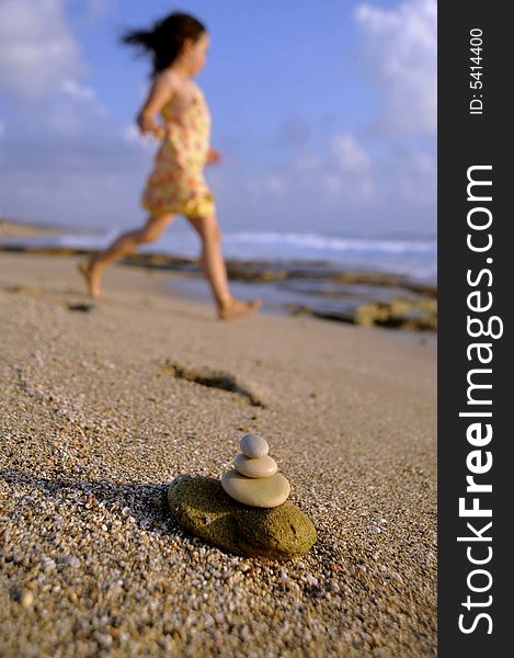 Balancing stones and girl at the beach. Balancing stones and girl at the beach