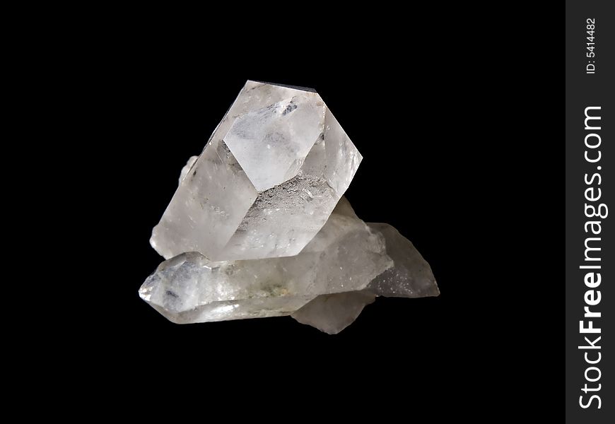 Peace of quartz isolated on black background.