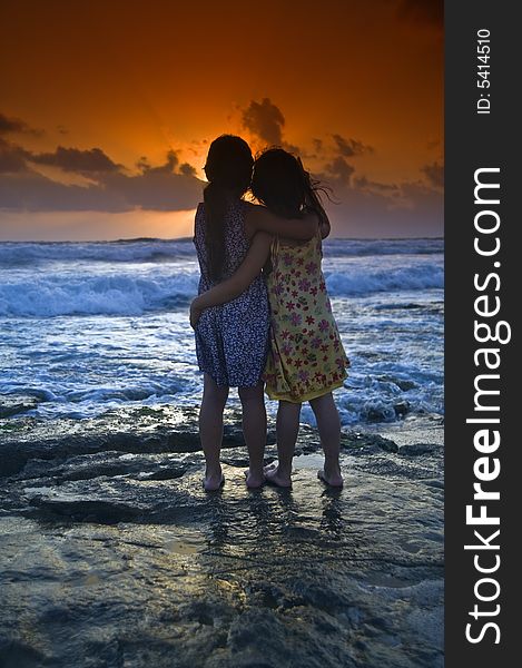 Two girls in the beach at sunset. Two girls in the beach at sunset