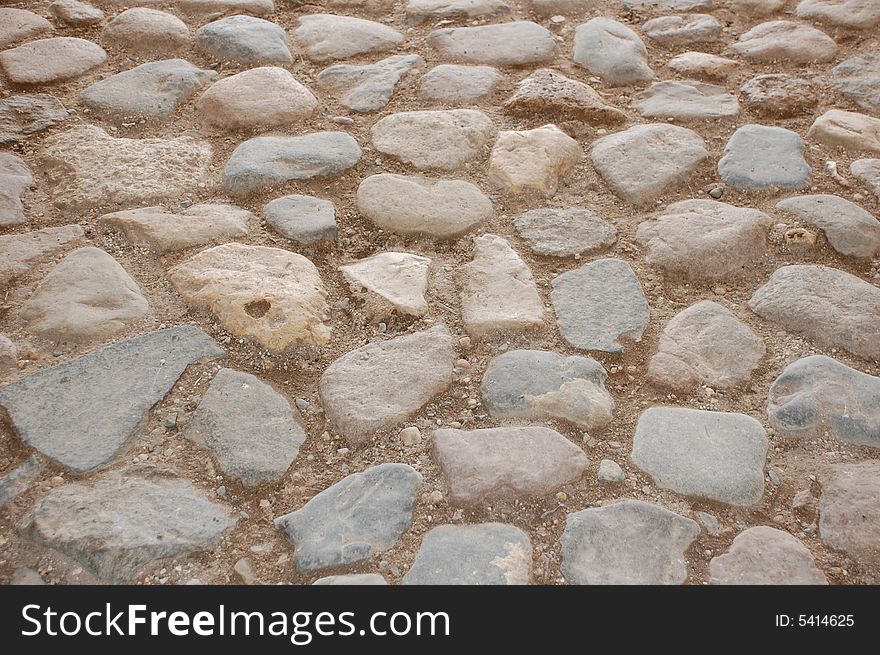 Cobblestone road.Unique ancient laying