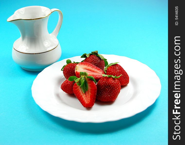 Fresh strawberry on white plait and blue background