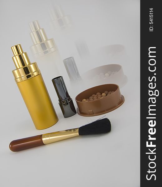 Perfume,lipstick,brushes and powder. Perfume,lipstick,brushes and powder