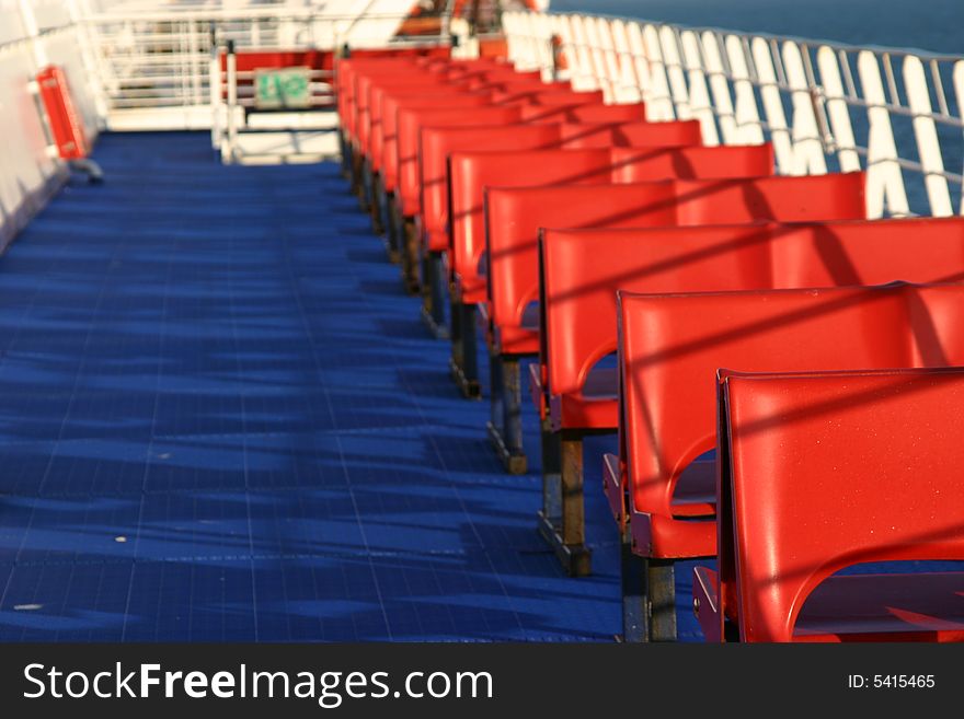 Line of red seats on ferryboat. Line of red seats on ferryboat