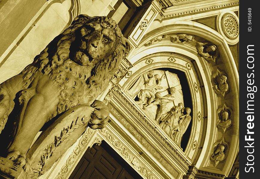 A detail of the facade of Santa Croce church in Florence with a lion. A detail of the facade of Santa Croce church in Florence with a lion.