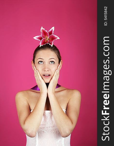 Beauty portrait of a young woman with a ribbon and a flower. Beauty portrait of a young woman with a ribbon and a flower