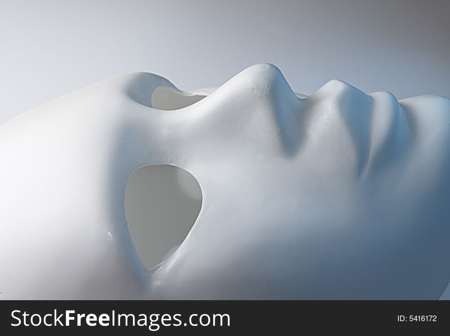 White mask on a grey background