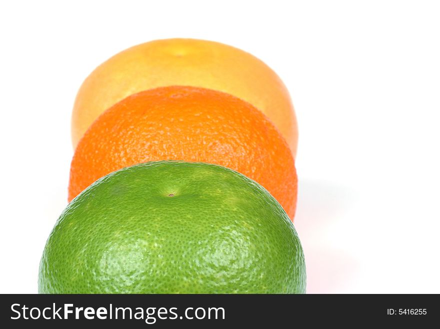 Tropical fruits: grapefruit, sweety, orange isolated on white background