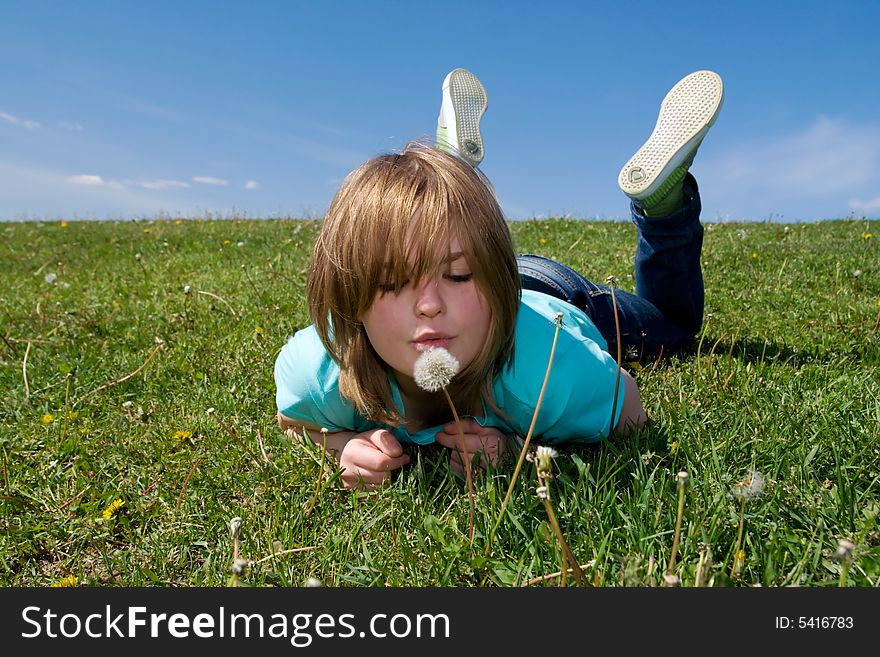 The young girl with a dandelion