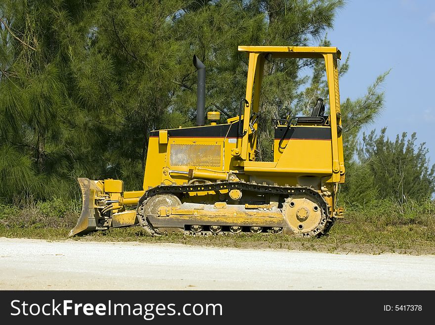 A small bulldozer sits idle