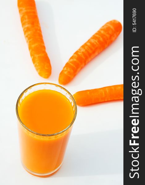 Carrots and carrot juice isolated on white