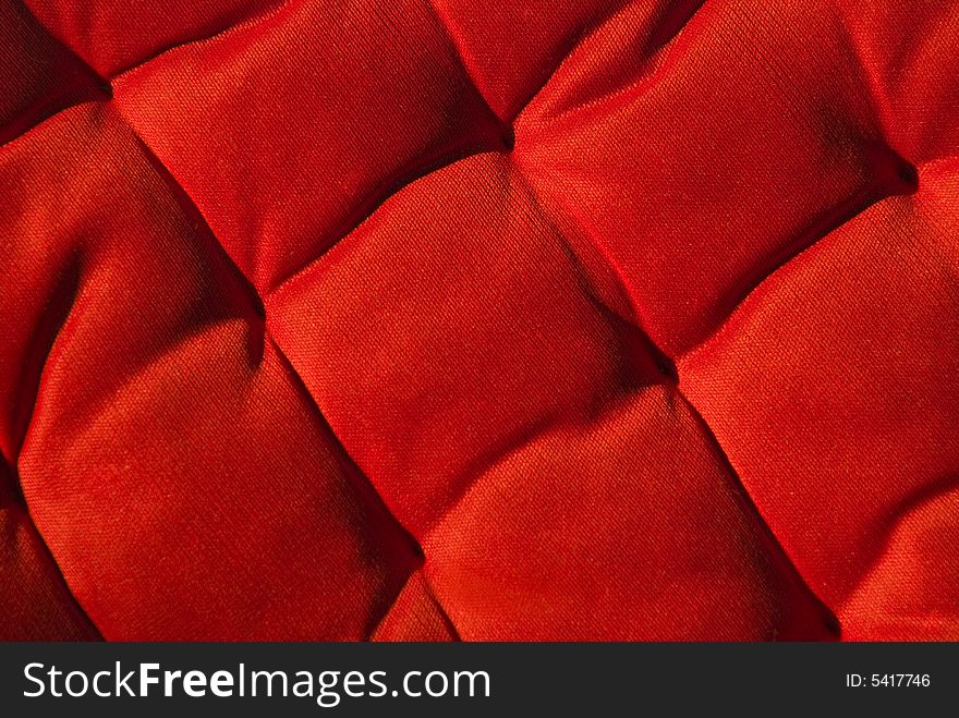 A detail image of a red cushion