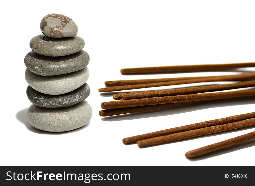 An image of balancing zen soft color stones and incense bars