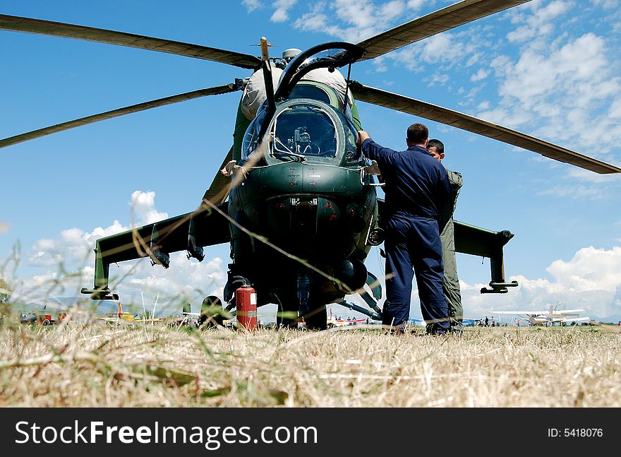 Military helicopter on the ground for maintinence. Military helicopter on the ground for maintinence