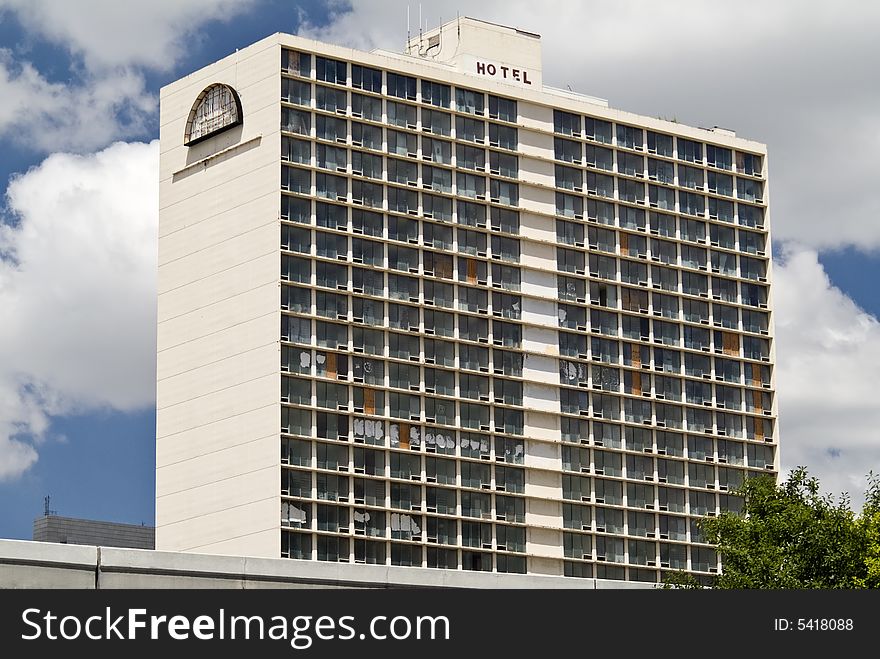 A large empty hotel building with evidence of vandalism and general abuse and neglect. A large empty hotel building with evidence of vandalism and general abuse and neglect.