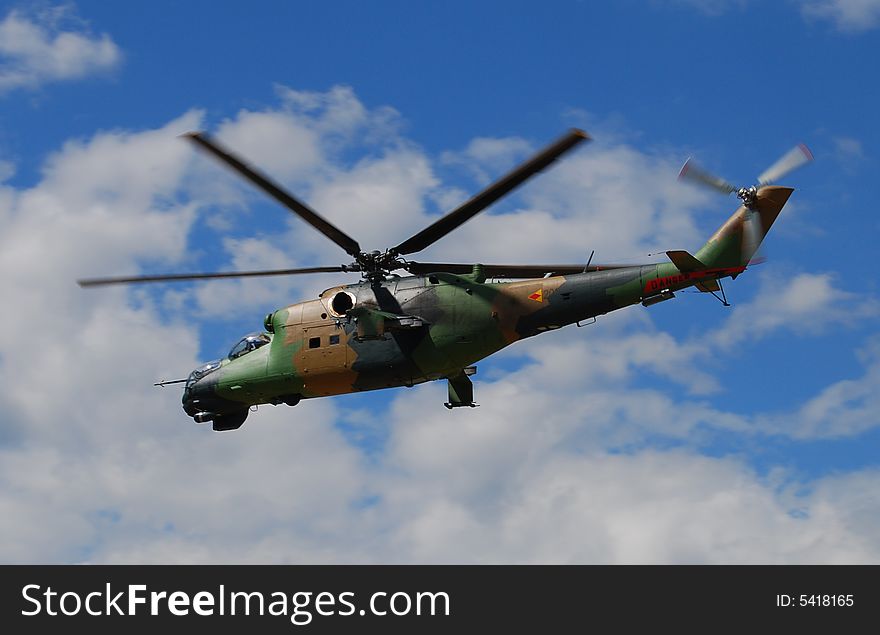 Military helicopter flying in the sky. Military helicopter flying in the sky